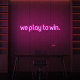"WE PLAY TO WIN." NEON SKILT