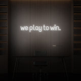 "WE PLAY TO WIN." NEON SKILT